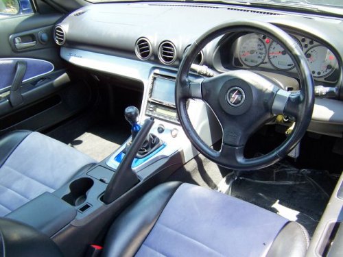 Driver side interior view of Japanese high performance car