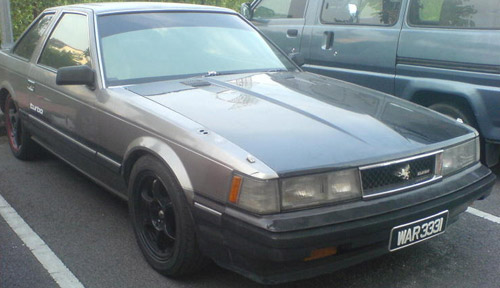 Early model Japanese import car grey color